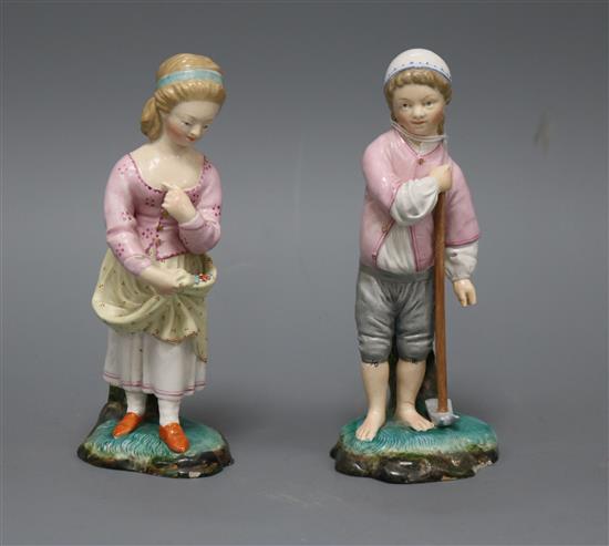 A pair of Continental pottery figures tallest 14.5cm